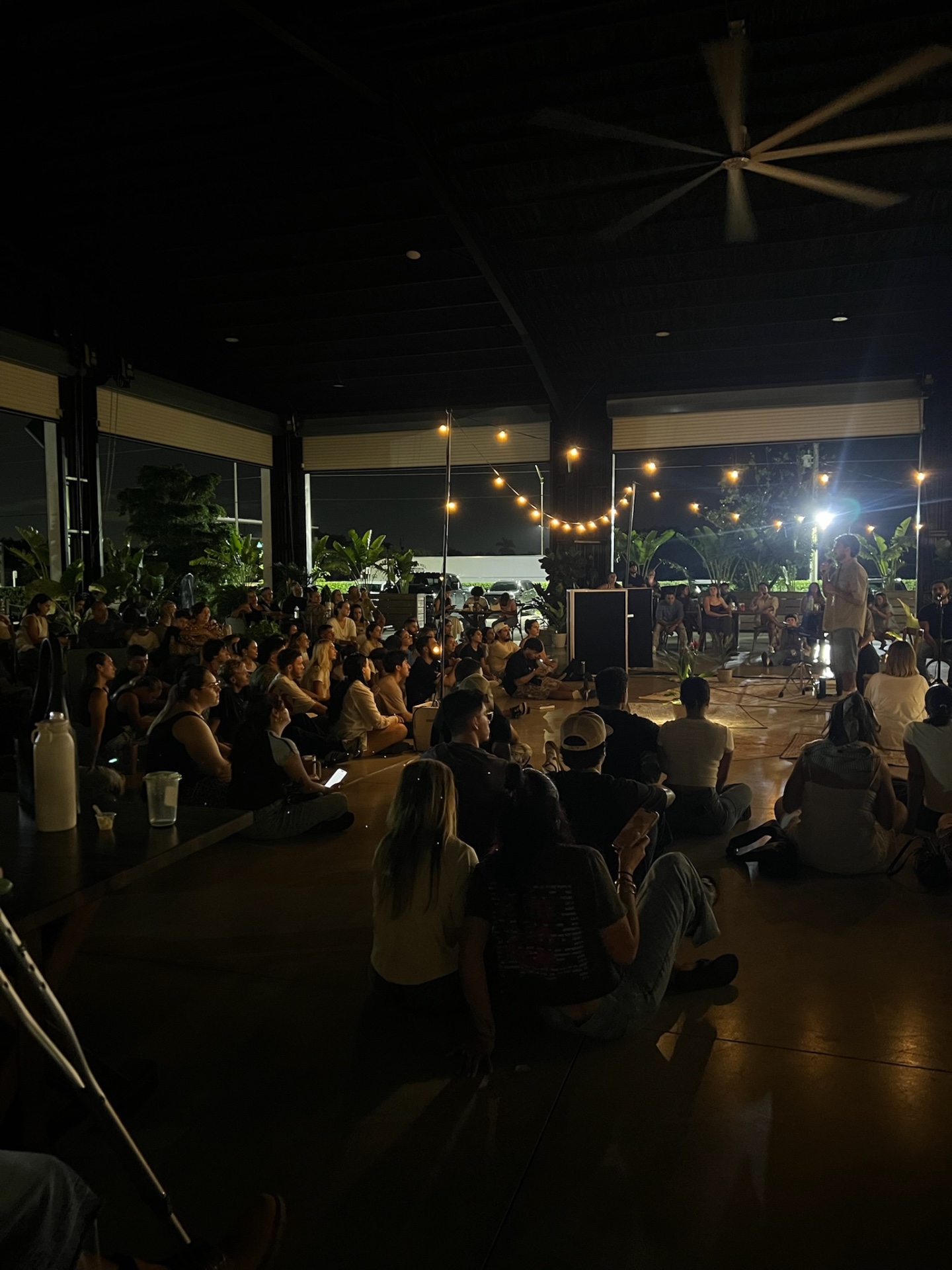 An evening message shared with the community beneath the lights